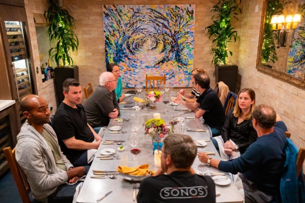 Group of people talking in the Cork Room at bouchon